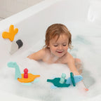Toddler assembling Puzzle Friends Dino World dinosaurs in the bath
