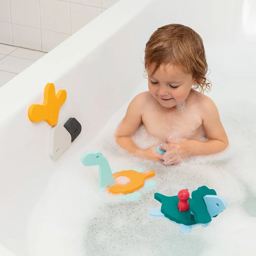 Child using finger puppets to act out prehistoric adventures with dinosaurs