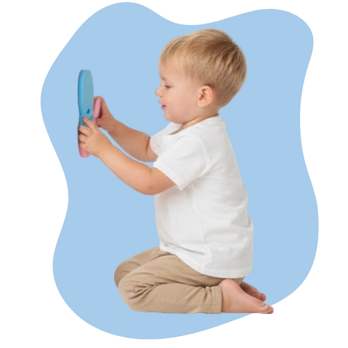 Toddler using bath puzzle shapes to improve hand-eye coordination