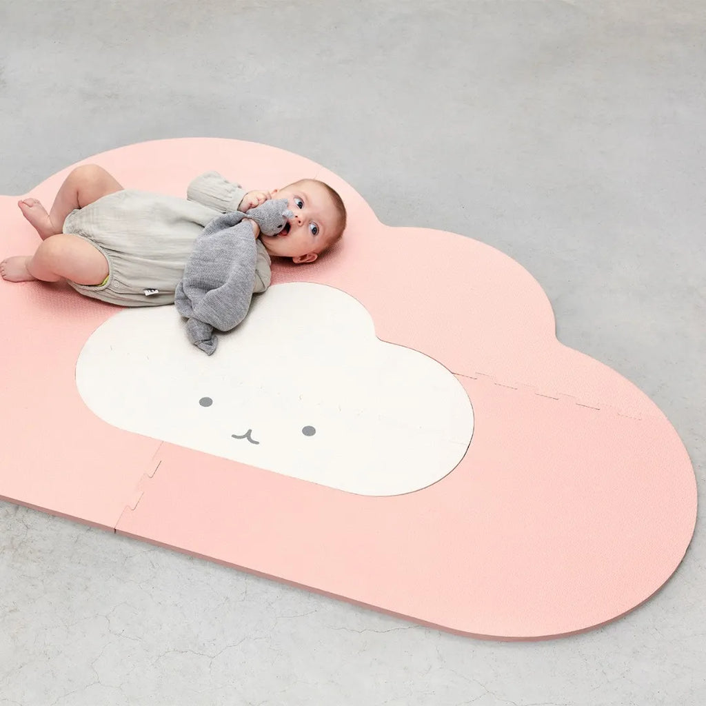 Baby enjoying tummy time on Clouds EVA foam playmat