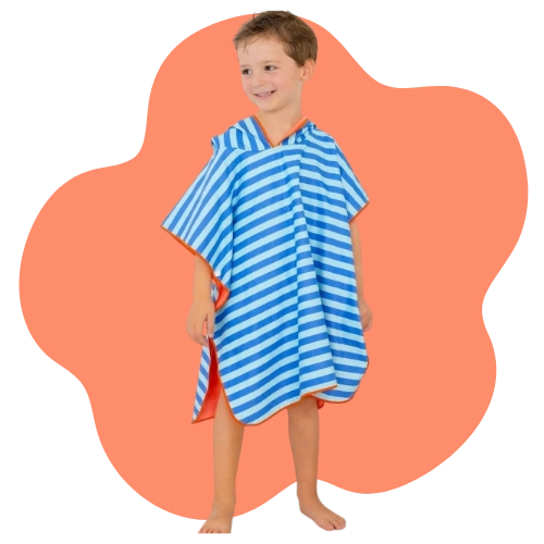 Close-up showing sand rolling off the poncho fabric, keeping kids clean