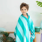 Children enjoying imaginative adventures on a safari game towel