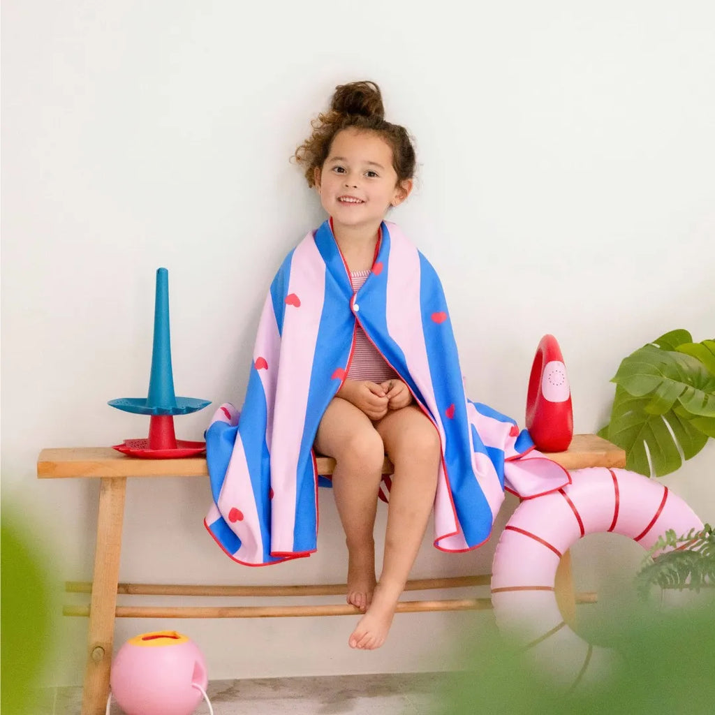 Children enjoying poolside play on a lightweight lighthouse towel