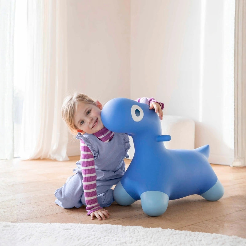 Kids laughing and hopping on a colorful inflatable dinosaur ride-on toy during indoor and outdoor play
