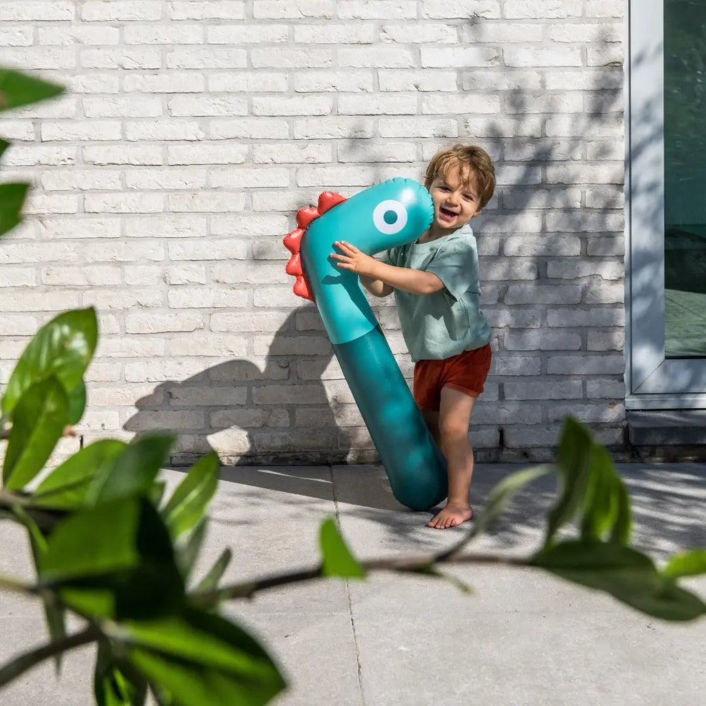 Kids enjoying Noodle Dino on land and in water for imaginative play