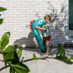 Kids enjoying Noodle Dino on land and in water for imaginative play