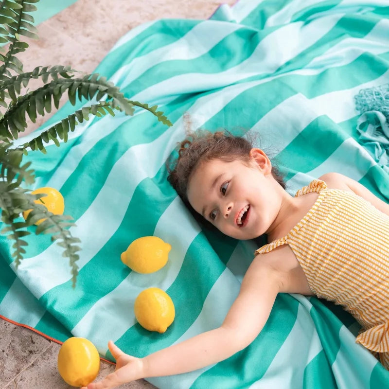 Children exploring and imagining on a safari-themed double-sided kids towel