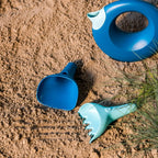 Children using Raki as a snow toy for digging and creative outdoor fun
