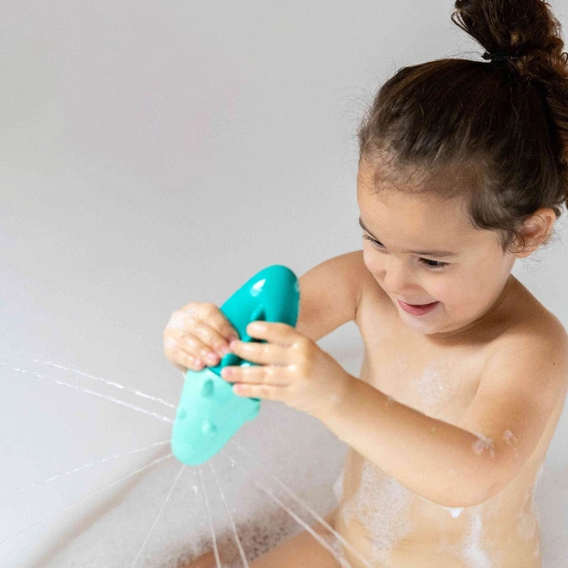 Squeezi Croco in action as toddlers squeeze, float, and explore water play