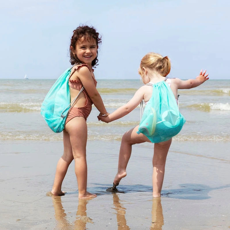 Quut Beach Set in action with kids building, scooping, and shaping sand creations