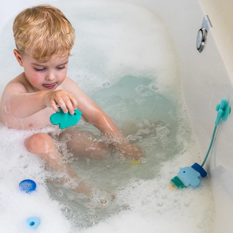 Beedi Fish in action with toddlers floating, sticking, and lacing foam beads during playtime