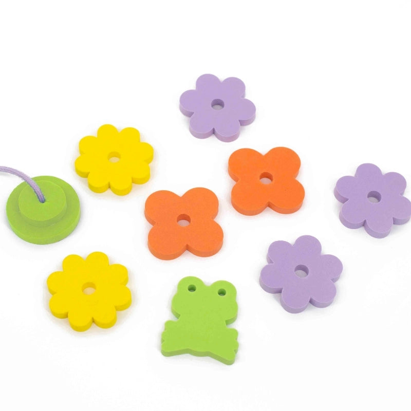 Toddler fishing frogs and water lilies with Fishing Frog Pond set in bathtub