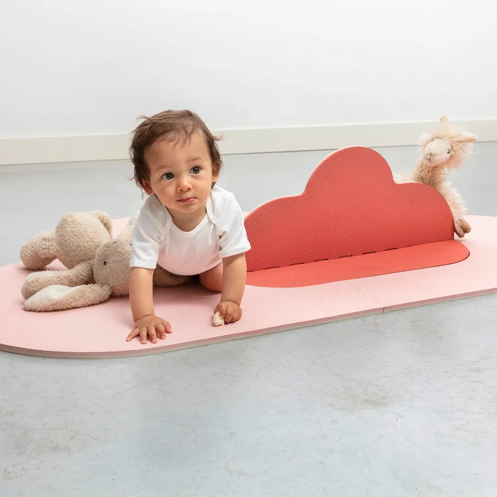 Toddler crawling and playing on soft Clouds Playmat