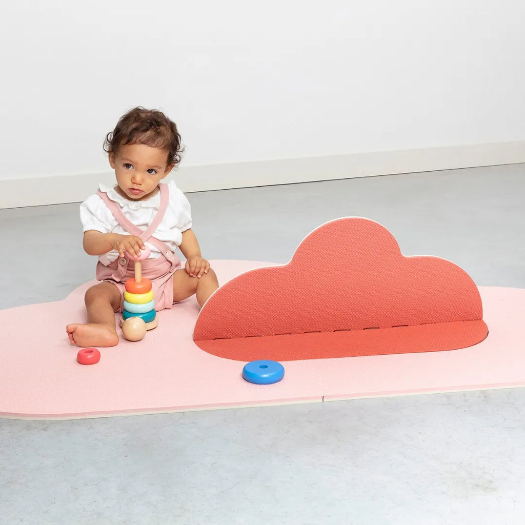Child sitting and playing on Clouds foam baby playmat