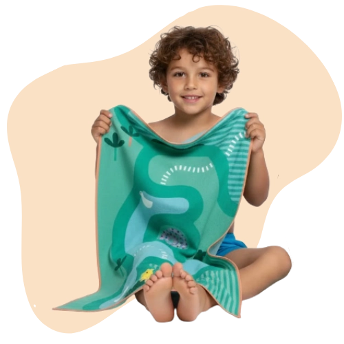 Kids creating stories and playing games on a safari-themed towel