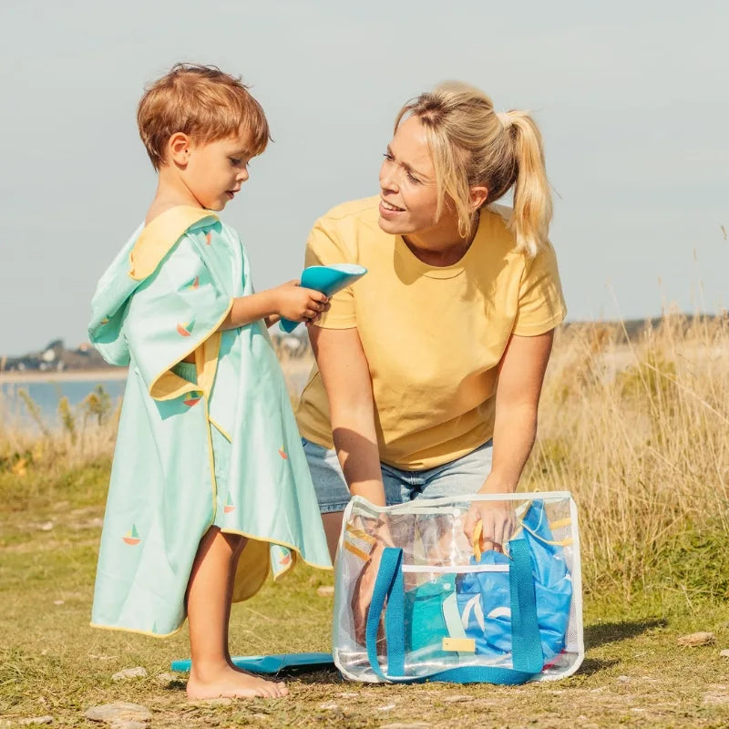 Kids playing with Bucki, Raki, and Magic Sand Shaper to dig, rake, and shape sand at the beach or garden