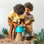 Little hands clicking together Alto components during beach play