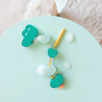 Toddlers developing fine motor skills with Beedi Croco foam beads