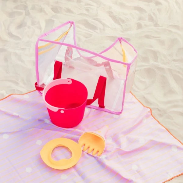 Close-up of Bucki bucket showing ergonomic handle and detachable sieve for sand or water play