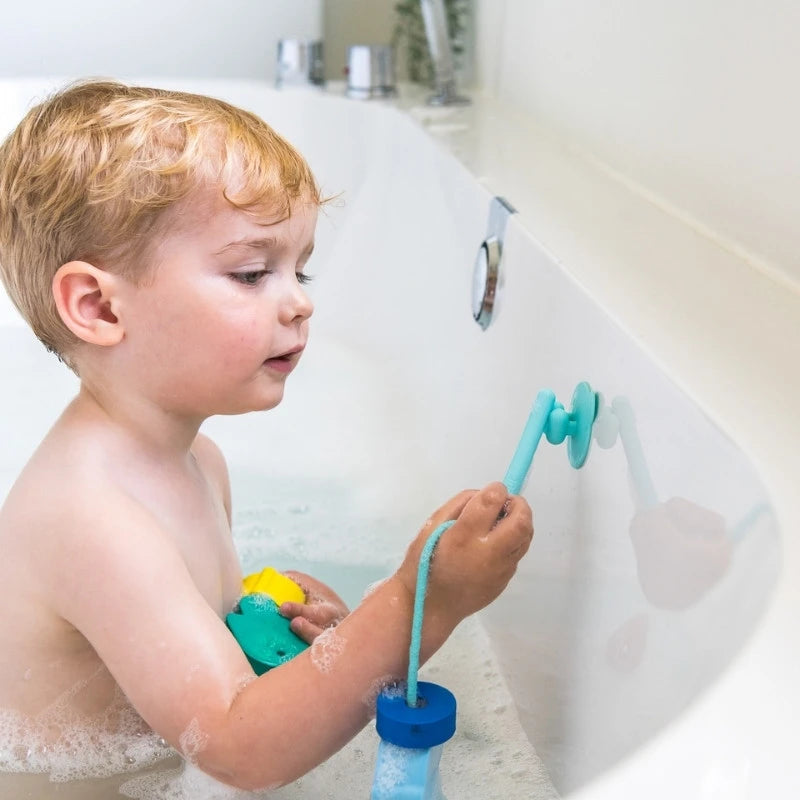 Kids enjoying imaginative water play with Beedi Fish lacing beads