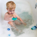 Toddlers improving fine motor skills with Beedi Fish foam beads