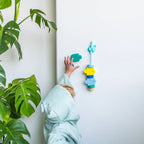 Kids sticking Beedi Fish beads to bathroom wall for creative play
