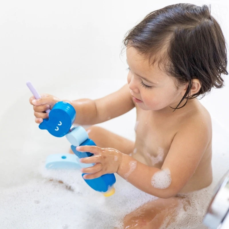 Toddlers exploring sensory water play with Beedi Hippo foam beads