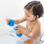 Toddlers exploring sensory water play with Beedi Hippo foam beads