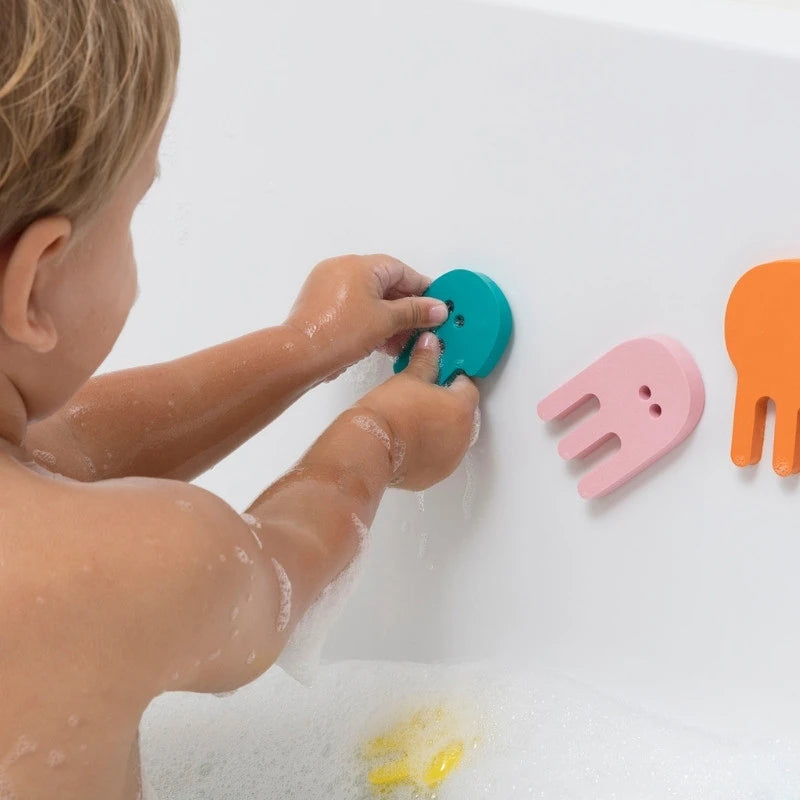 Kids exploring creative bath play with jellyfish foam puzzle