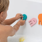 Kids exploring creative bath play with jellyfish foam puzzle