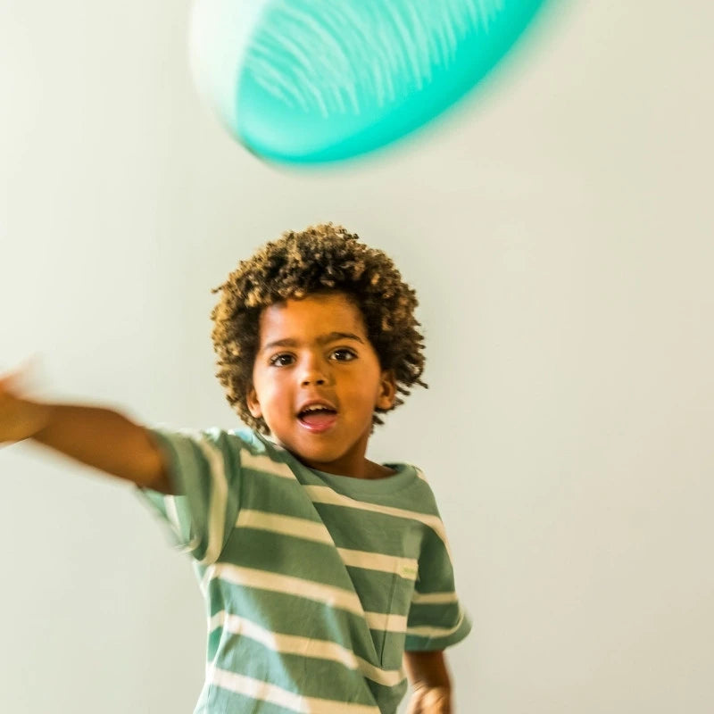 Children enjoying outdoor flying disc games together