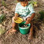 Kids using Bucki bucket and detachable sieve to gather seashells and treasures
