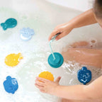 Kids exploring bath fishing game together with rods and fish