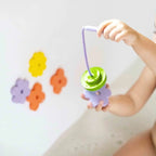 Floating foam frogs and water lilies that stick to tub walls