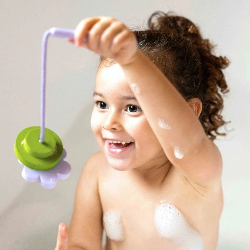 Kids using rod to catch floating pond pieces for imaginative play