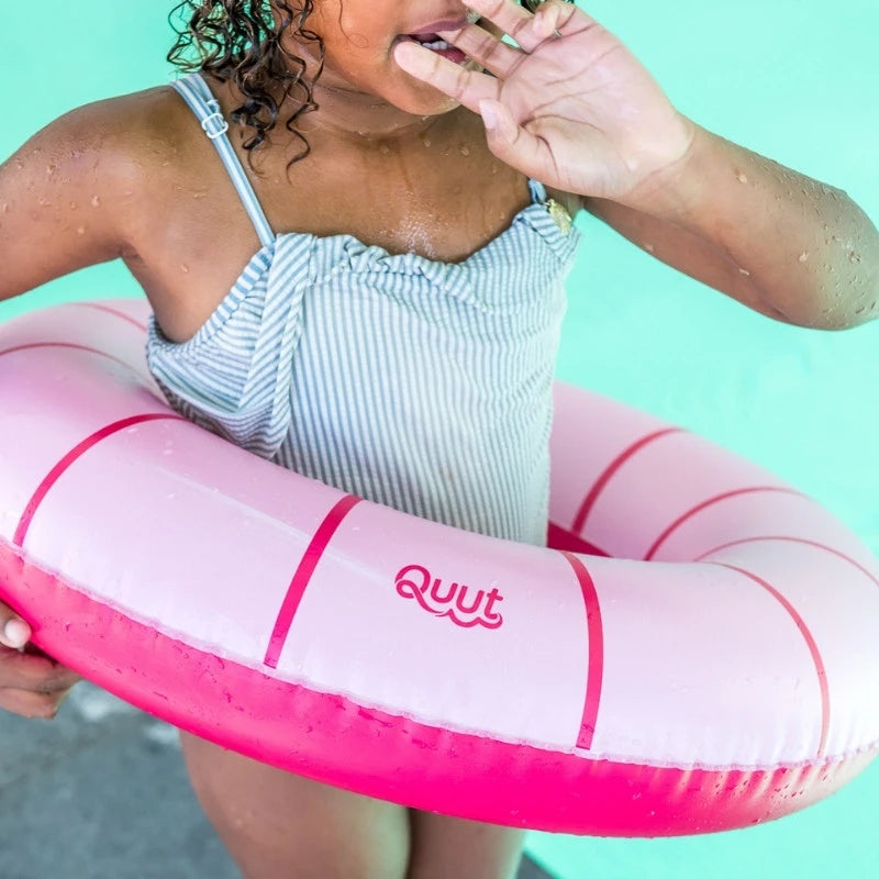 Kids using Swimring for supervised outdoor water fun