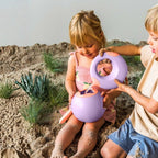 Kids filling Mini Ballo buckets at the garden water table