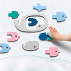 Child playing with EVA foam whale bath puzzle during bath time