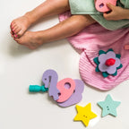 Stars and foam shapes laid out to show size, texture, and colorful design