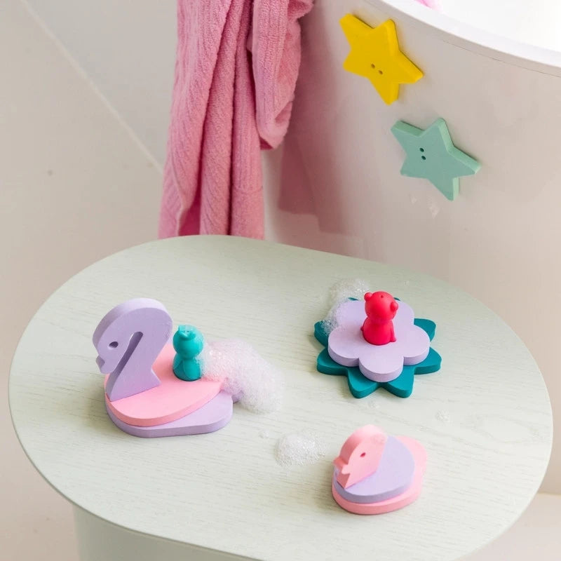 Swans and flowers floating on water, highlighting floating functionality