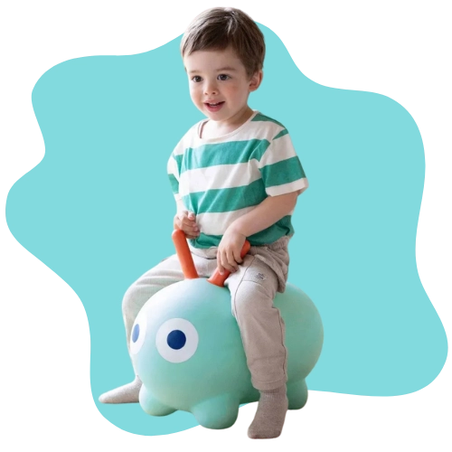 Toddler bouncing on an inflatable toy to support balance and muscle strength