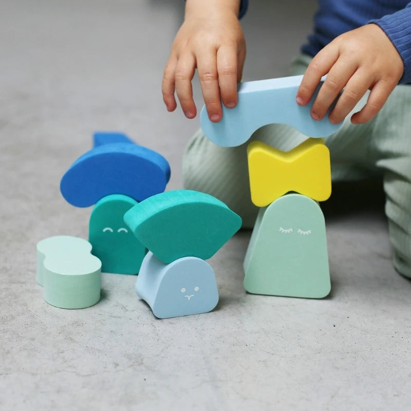 Child exploring creative construction with Blokki stacking blocks