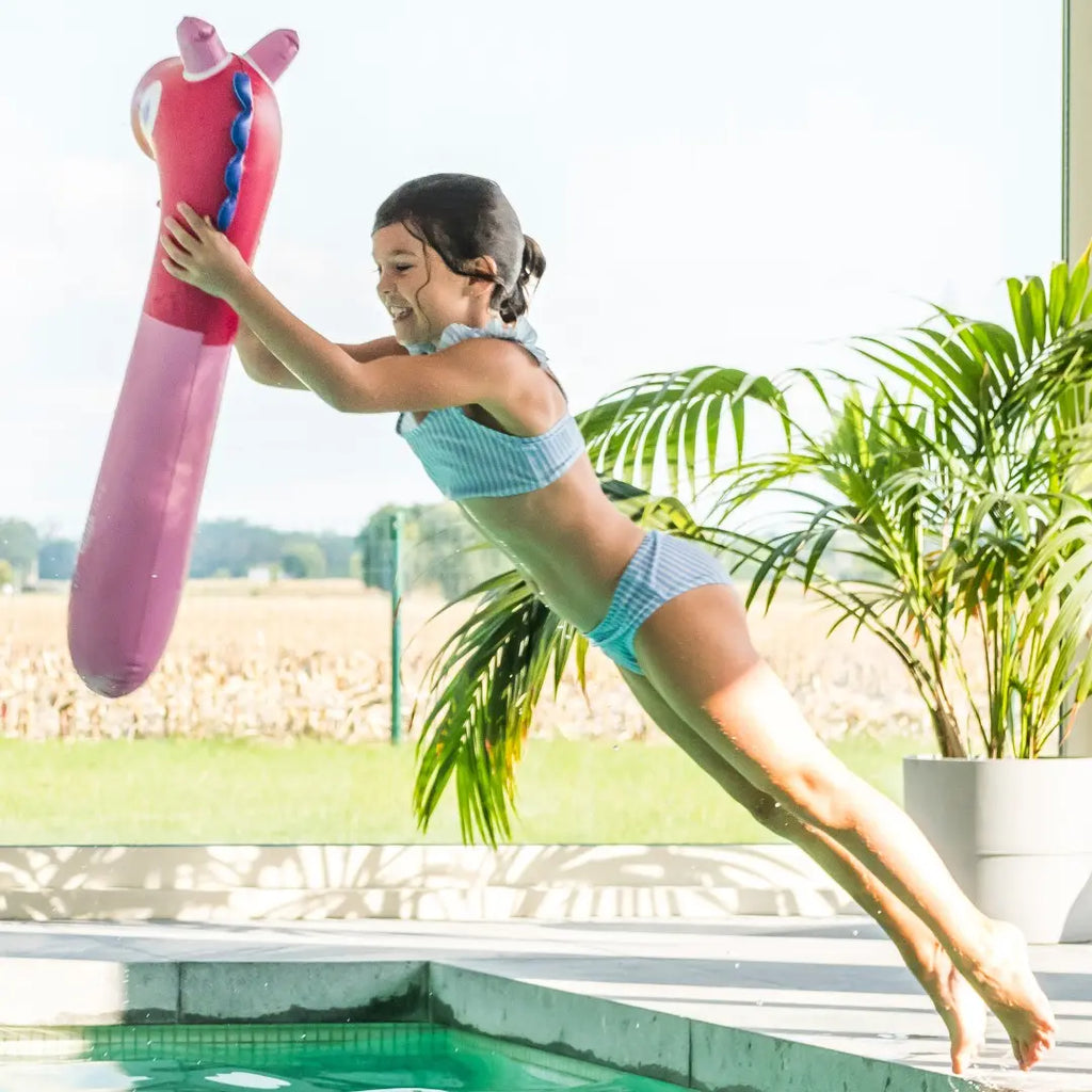 Kids playing with Noodle Horse on land and in water for imaginative fun