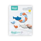 Close-up of Bath Puzzle Shark pieces showing 3D floating foam shapes