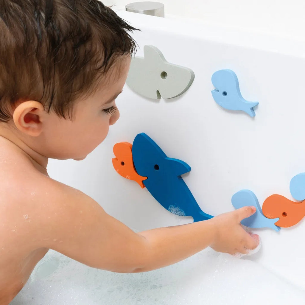 Parent and child playing with Bath Puzzle Shark to boost creativity and skills