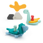 Close-up of floating EVA foam dinosaurs and volcano pieces in the bathtub