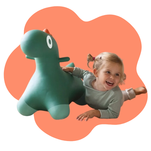 Toddler bouncing on a dinosaur ride-on toy, building balance and coordination through active play