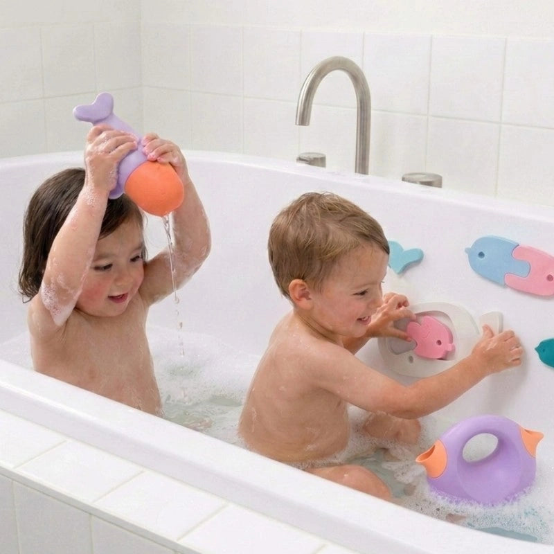 Toddlers splash, squeeze, puzzle, and pour with the Whale Bath Bundle during bath time, building fine motor skills and creativity through safe water play.